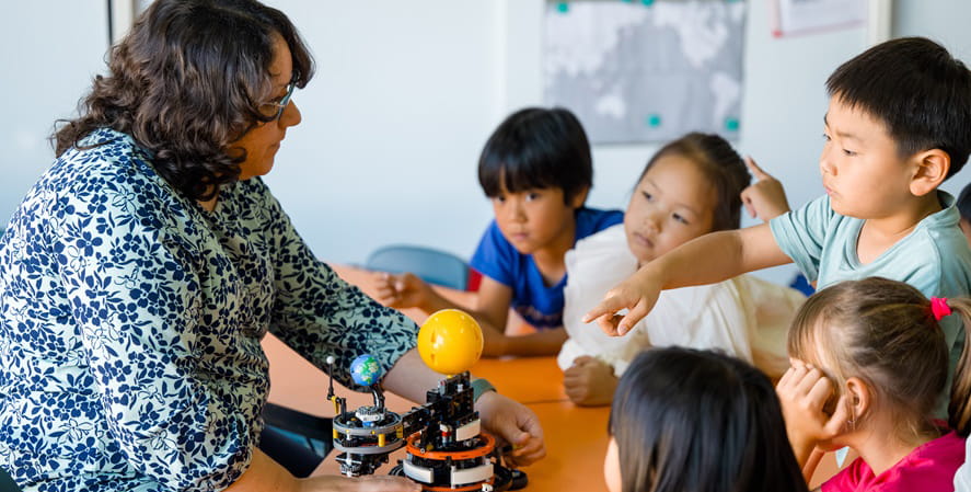 Ms. Tafoya and Grade 1 students during STEM class